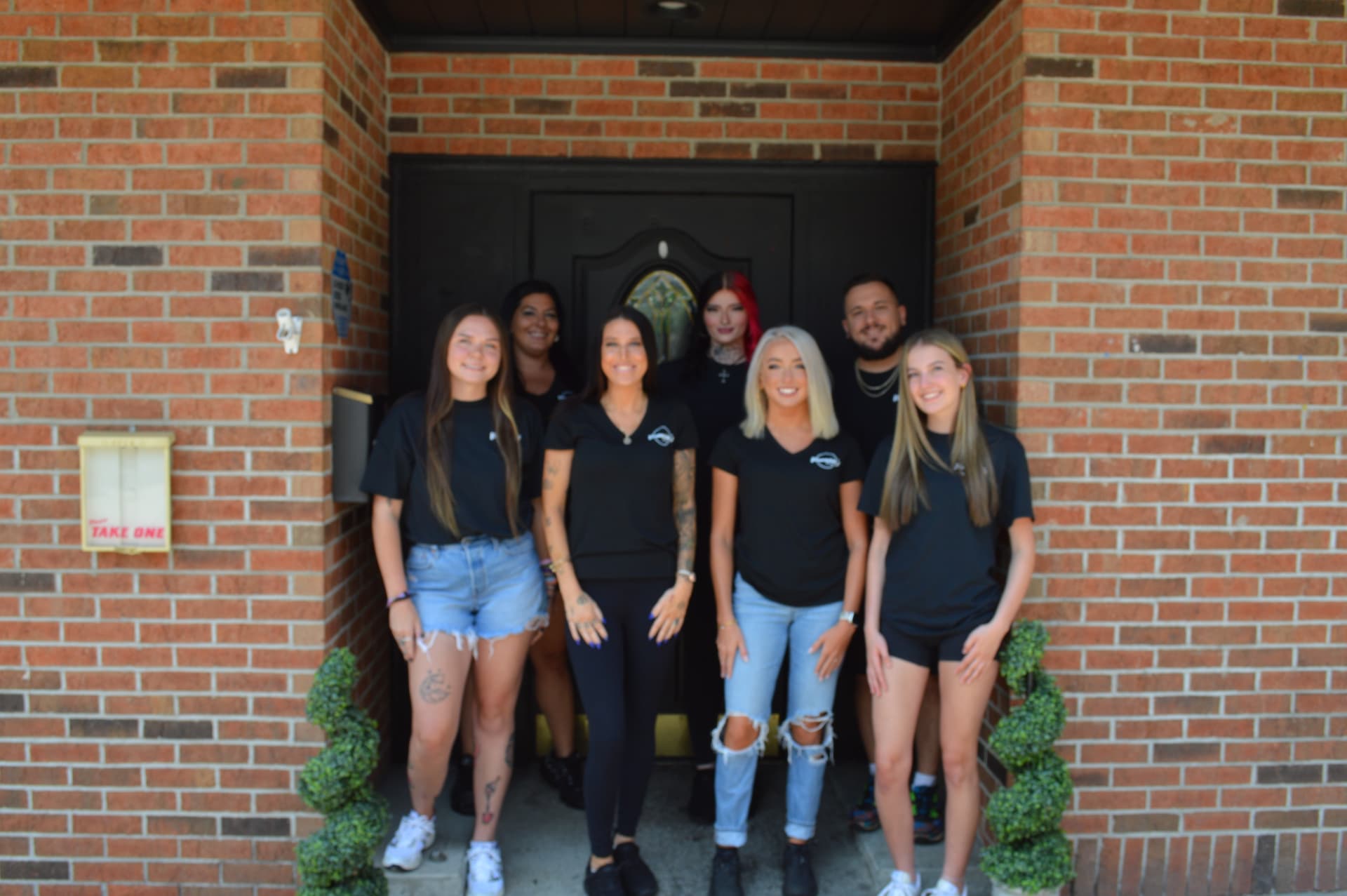 The Veronica's on Cavitt hospitality team gathered outside the front entrance of the restaurant